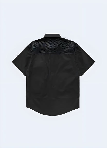 Rear view of a sleek black tactical techwear shirt featuring a large utility pocket and adjustable hem, designed for functionality and style in the UK.