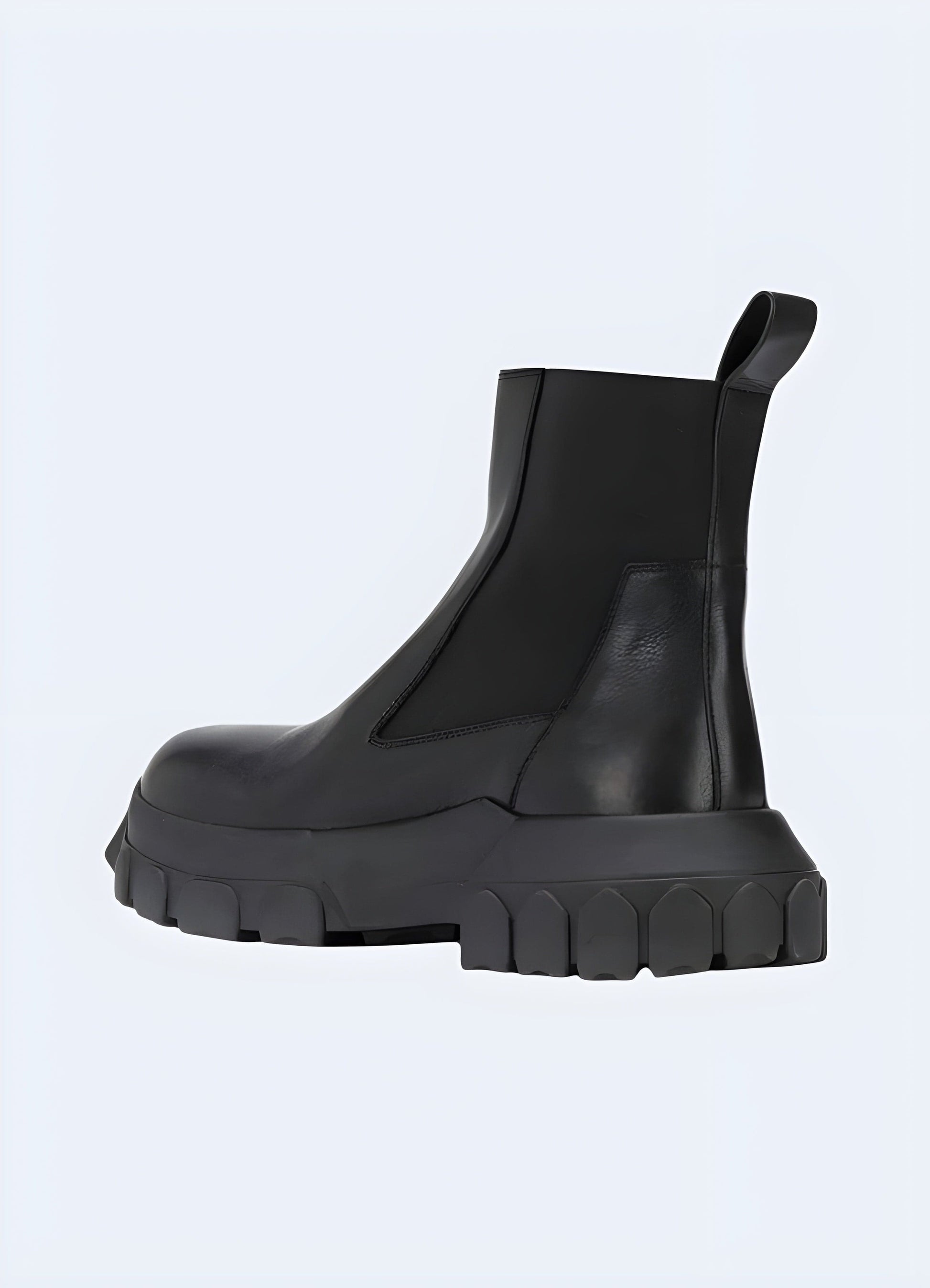 Back side view of techwear Chelsea boots, emphasizing their clean lines and durable construction, ideal for navigating UK urban environments in style.