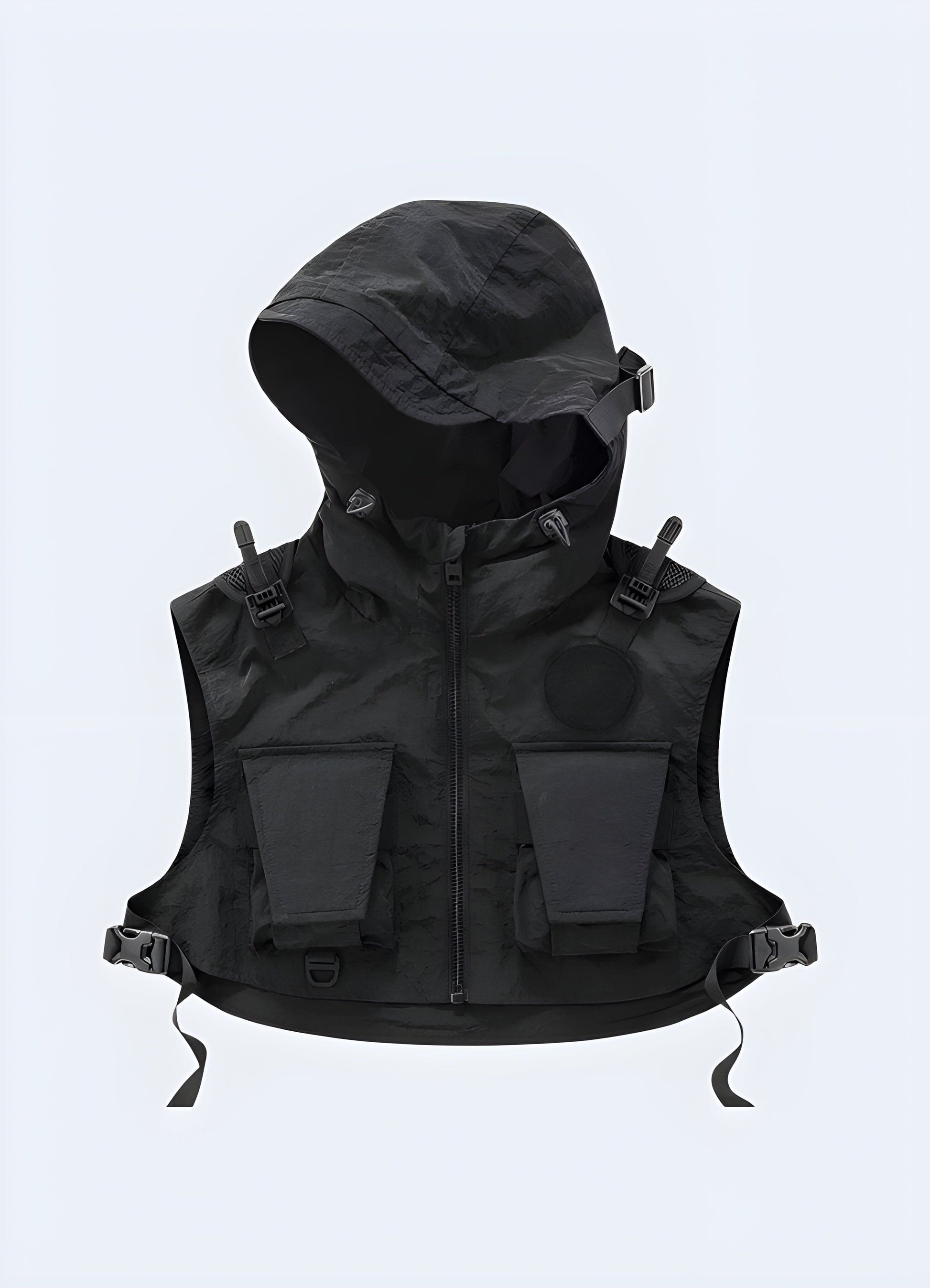 Model wearing a black techwear cropped vest with a high collar, zipper detail, and adjustable straps, showcasing a futuristic and stylish look.