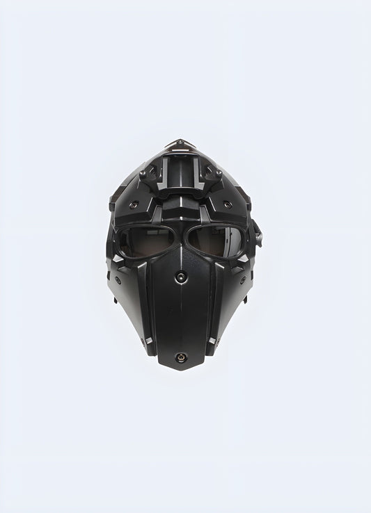 Black techwear helmet with futuristic design and sleek visor, UK.