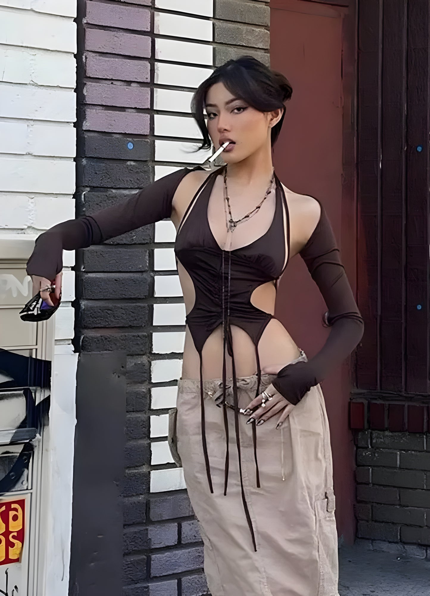 Side view of a techwear lace-up crop top, emphasizing its cutting-edge aesthetics and advanced materials for women embracing futuristic style in the UK.
