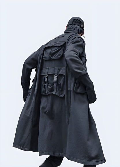 Back view of a relaxed fit techwear long coat, designed for layering and urban exploration in the UK.