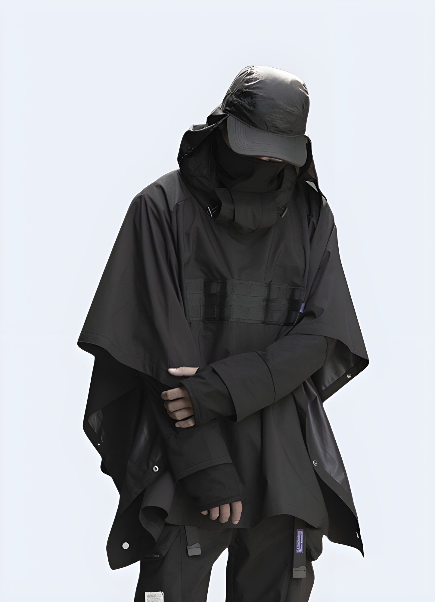 Innovative techwear poncho for men and women, designed for functionality and style in the UK urban environment.