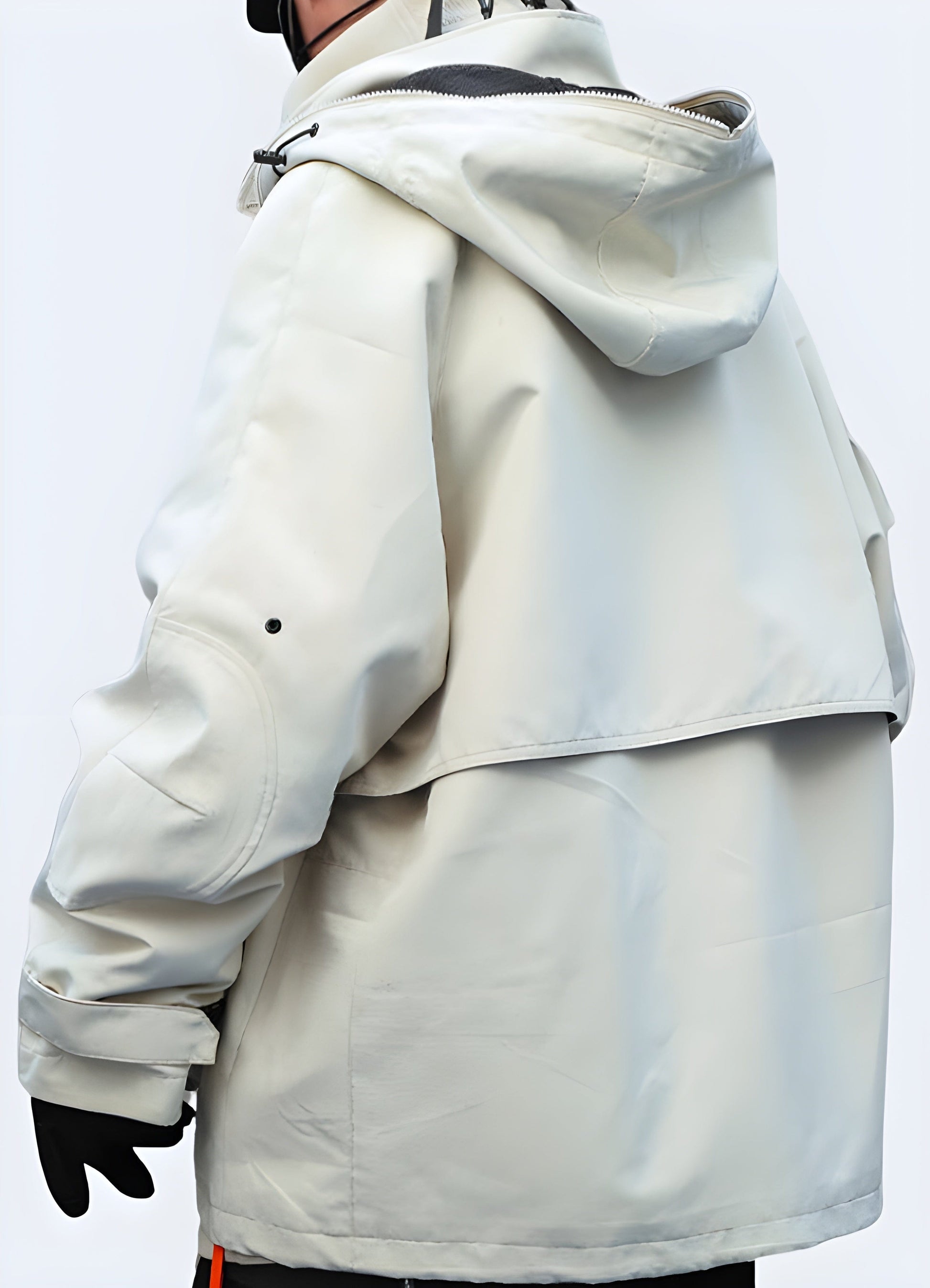 Back view of a waterproof techwear rain jacket, showcasing its technical design and functionality in the UK.