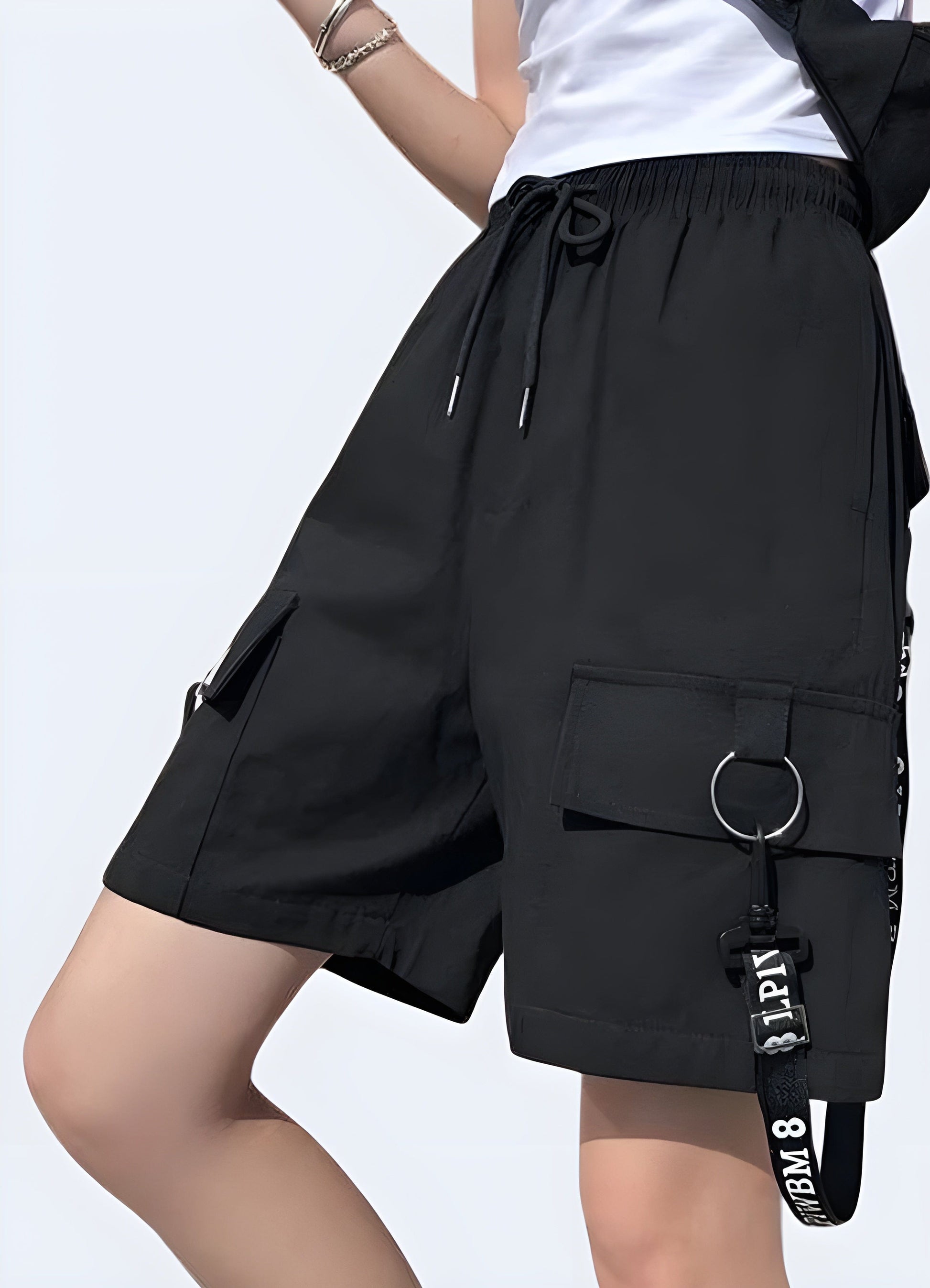 Front and side view of women's techwear shorts, highlighting the functional pockets, adjustable waistband, and versatile style for UK fashion enthusiasts.