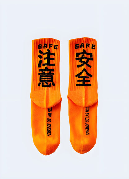 Back and side view of orange Tokyo street socks, displaying the bold color and eye-catching design that captures the essence of Tokyo's vibrant street culture for UK consumers.