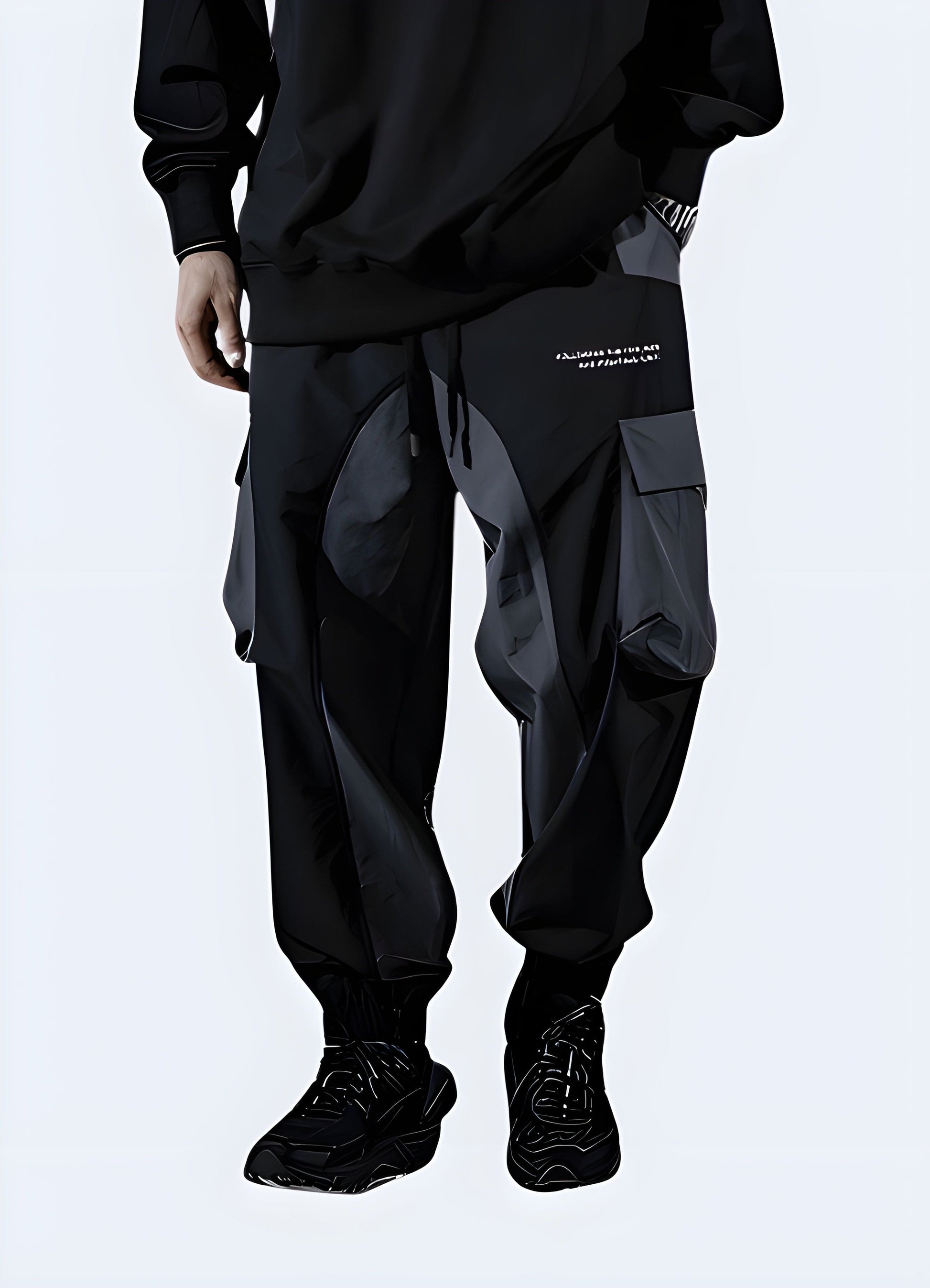 Man sporting black cyberpunk joggers, front side view, trendy urban clothing style in the UK.