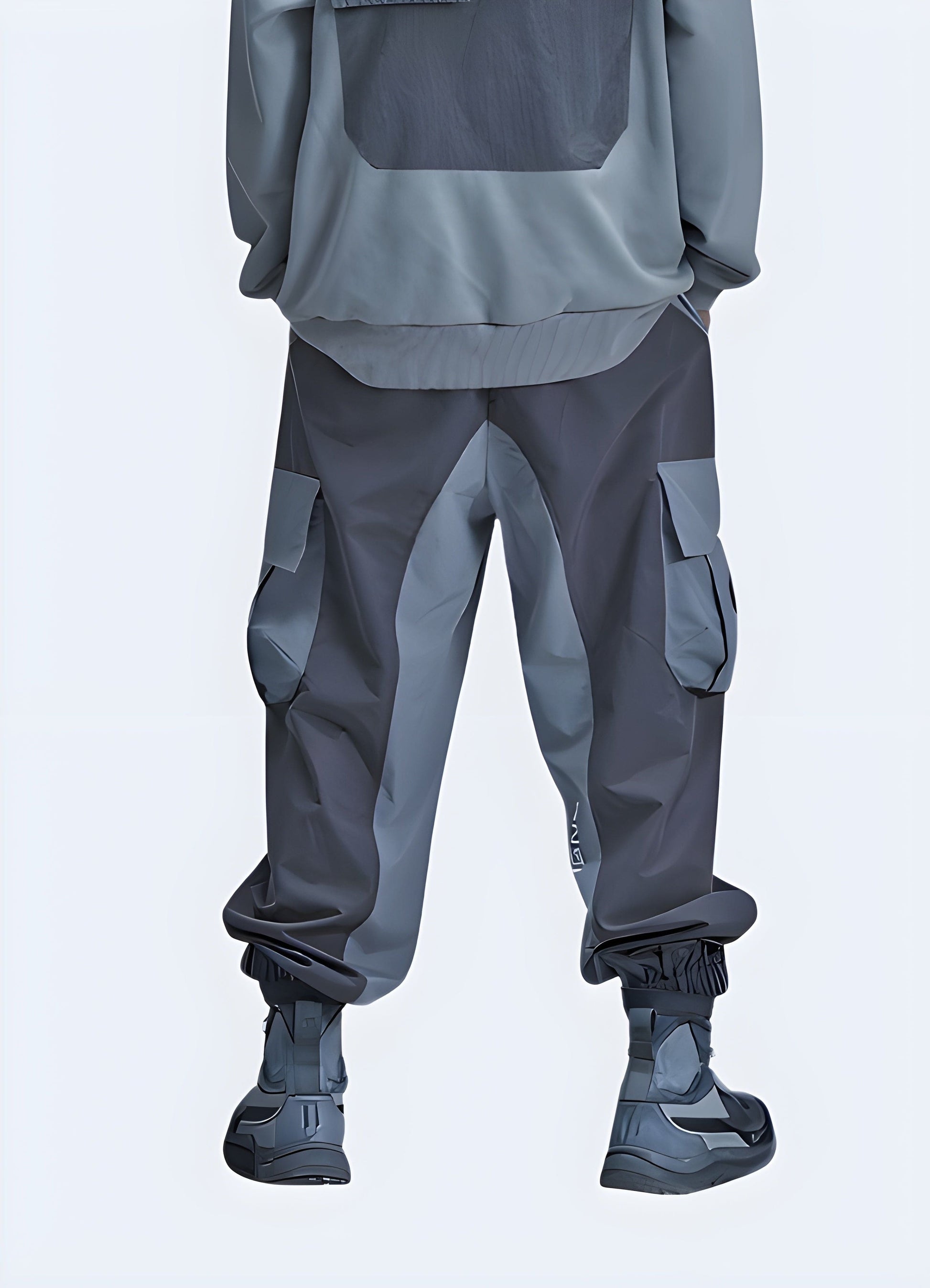 Man donning grey cyberpunk joggers, back side view, cutting-edge athleisure wear for UK fashion enthusiasts.