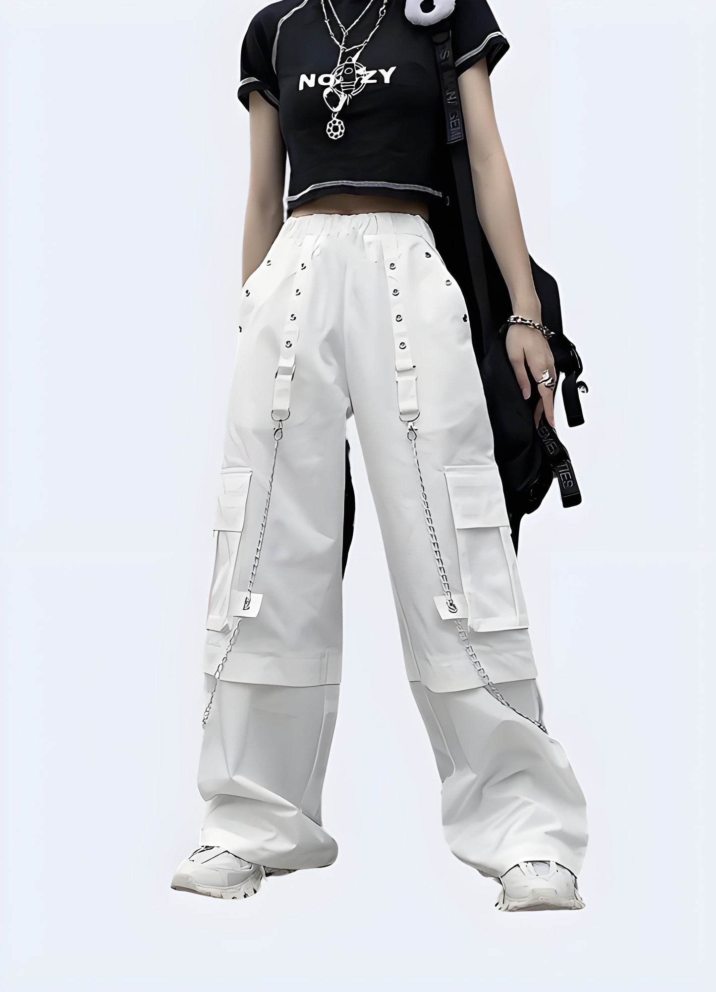 White cargo pants adorned with edgy silver chains, photographed in a modern UK setting, showcasing a fusion of utility and punk fashion.