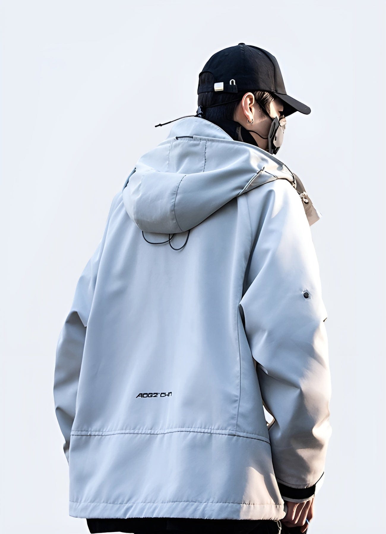 Back view of a white streetwear jacket showcasing ribbed details, highlighting its modern aesthetics, high-quality construction, and eye-catching features, perfect for style-conscious individuals in the UK's streetwear scene.