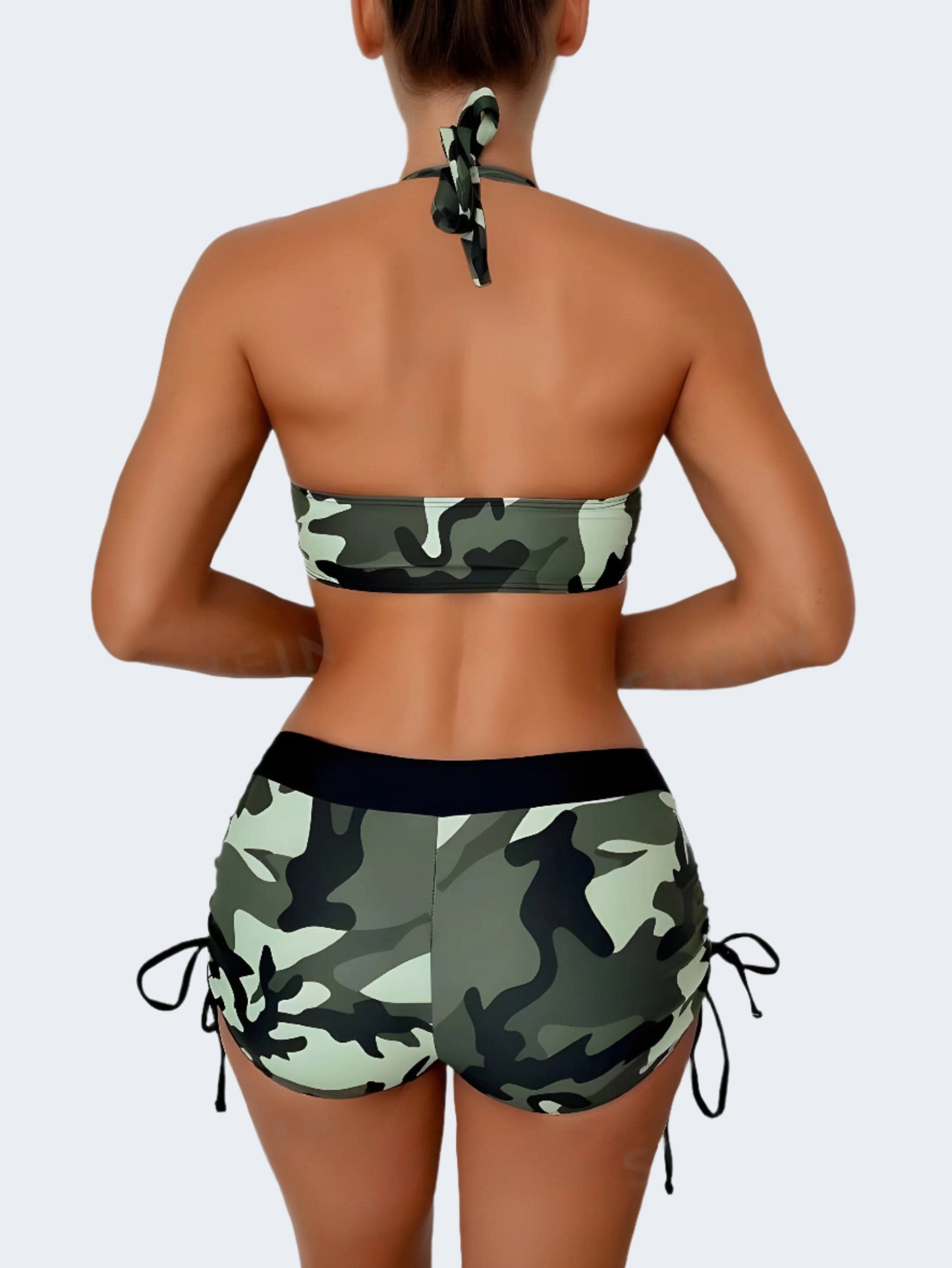 Beautiful woman confidently modeling a trendy camo bikini from the back view, showcasing the unique pattern and flattering cut of this must-have swimwear piece for adventurous summer style in the UK.