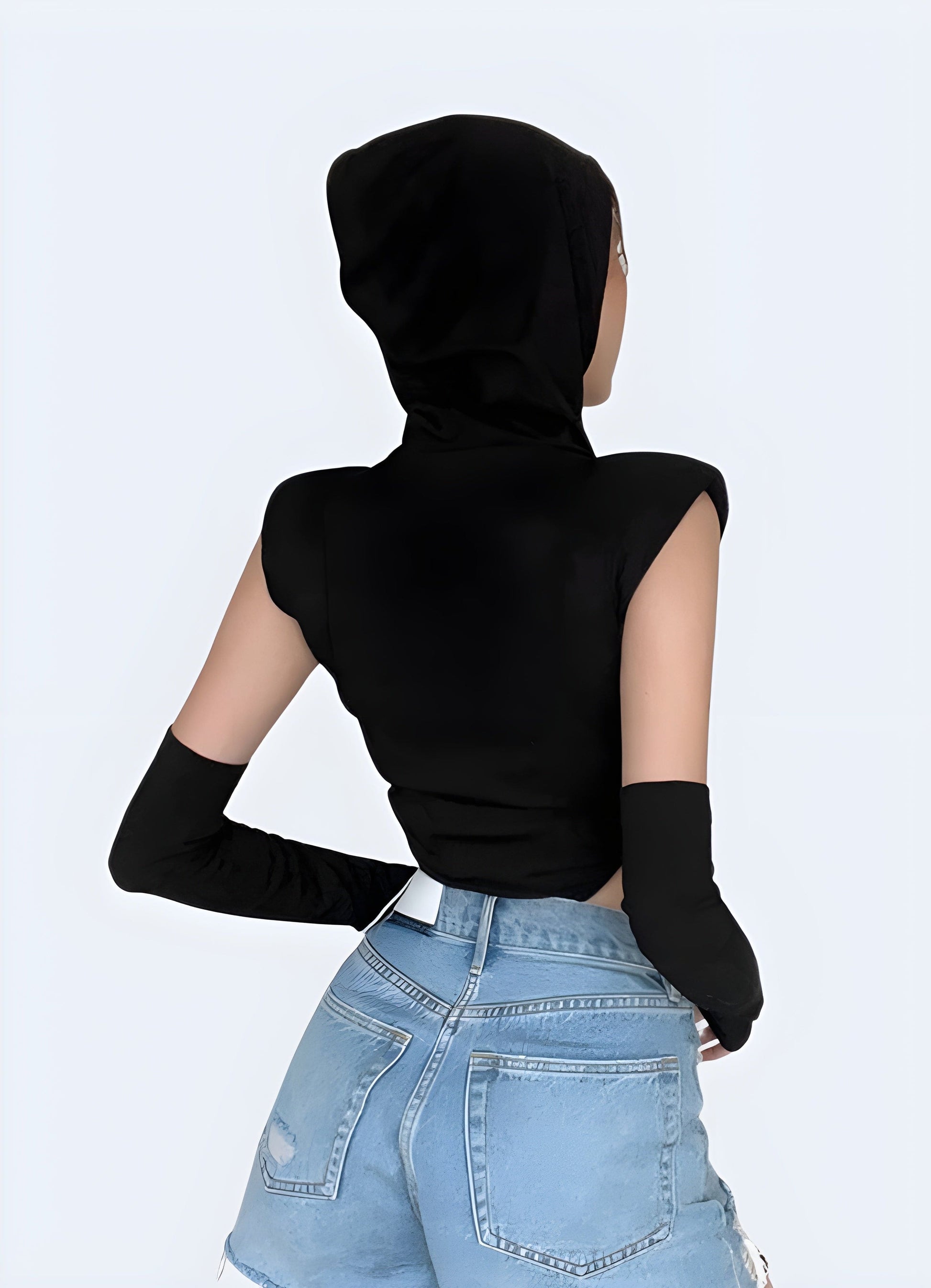 Back view of a woman in a cutting-edge techwear hooded bodysuit, highlighting the garment's unique features and urban style for UK wearers.