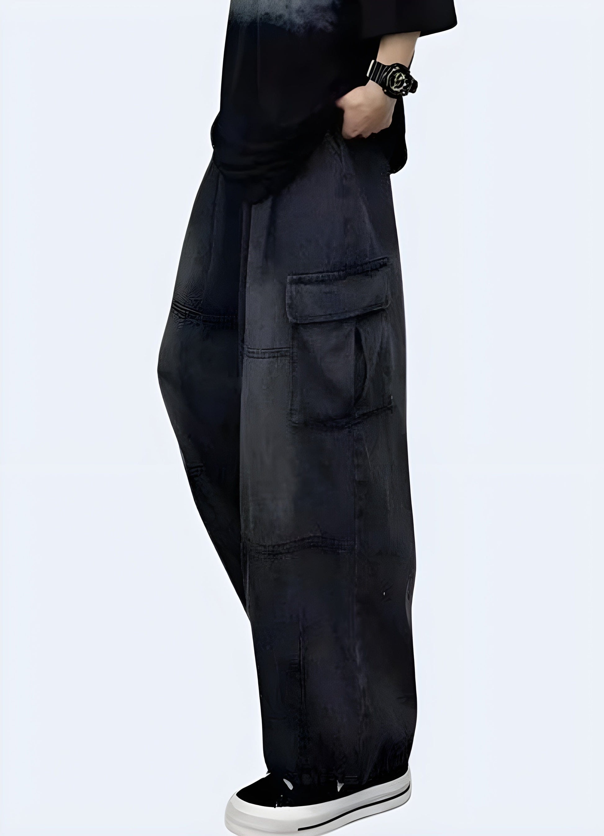 Side view of a woman wearing trendy black baggy cargo pants, showcasing the relaxed fit and versatile style, available for UK customers.