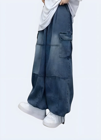 Side view of a woman modeling trendy blue baggy cargo pants, emphasizing the relaxed fit and versatile style, available for UK customers.