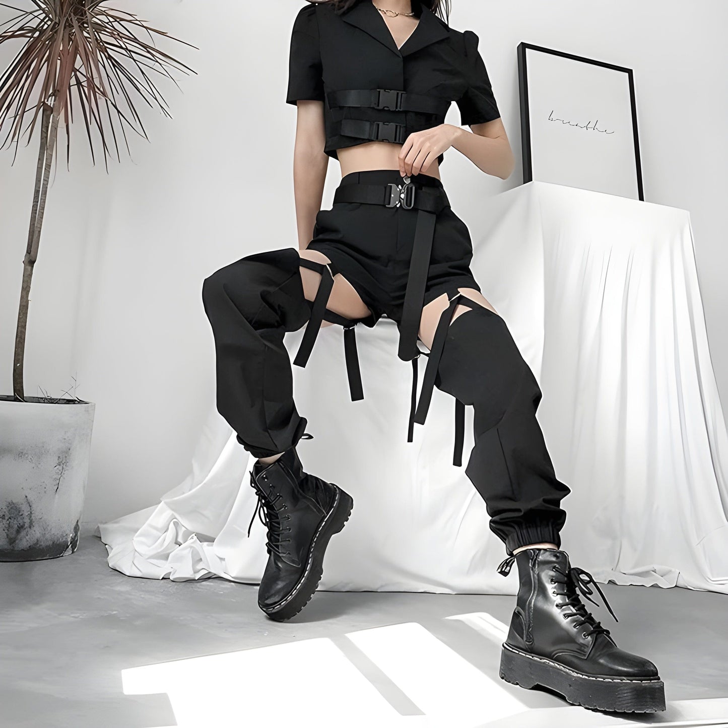 Model view of a woman wearing adjustable cargo pants, showcasing the practical and stylish design popular among UK fashion enthusiasts.