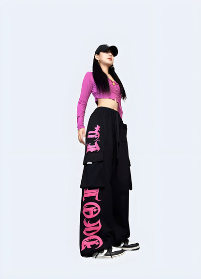 Right side view of a woman wearing black and pink cargo pants, highlighting the fashionable and functional style ideal for everyday wear in the UK.