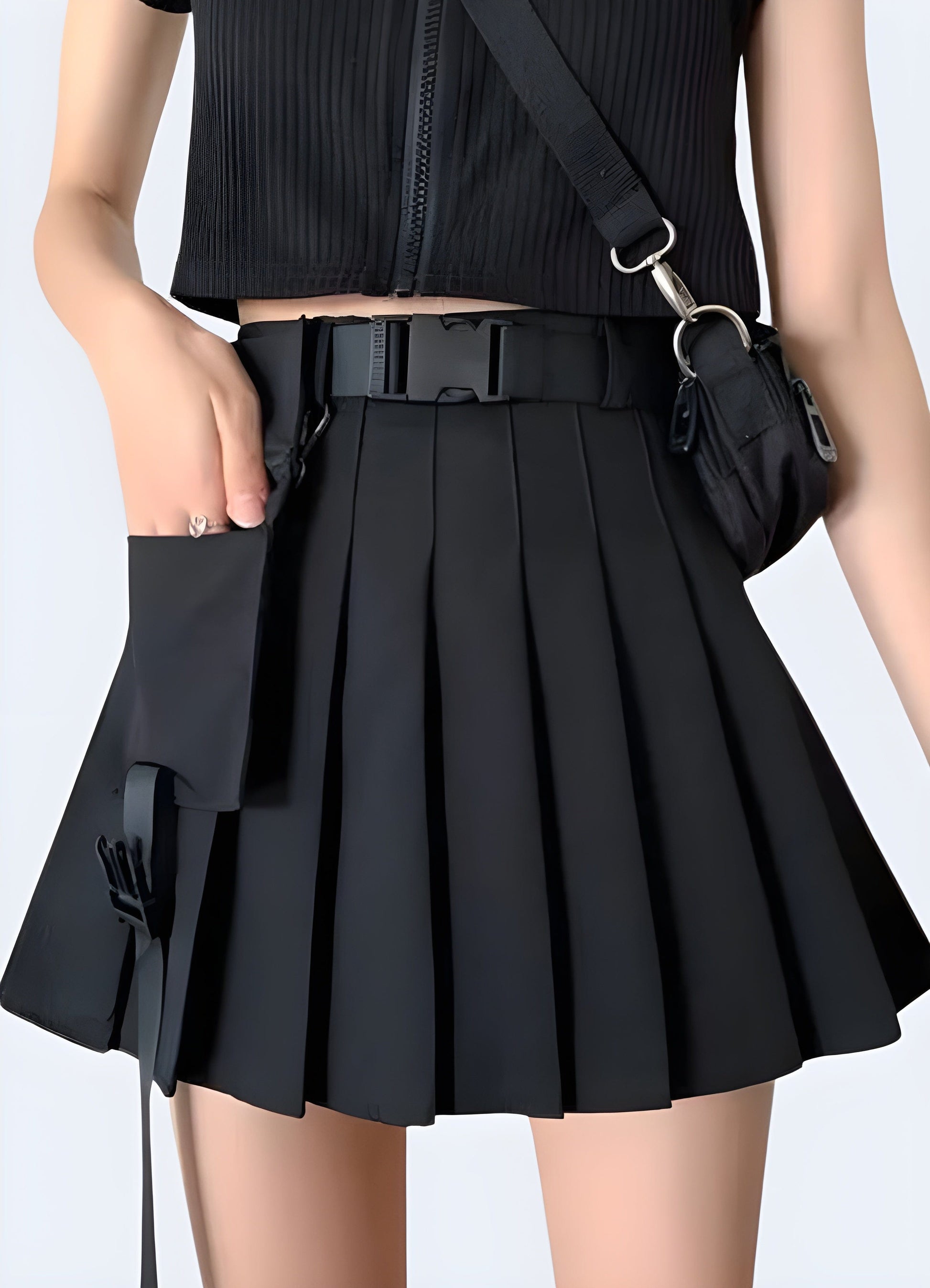 Front view of a woman wearing a black cargo mini skirt, showcasing its unique pocket details and modern silhouette for fashion-forward women in the UK.