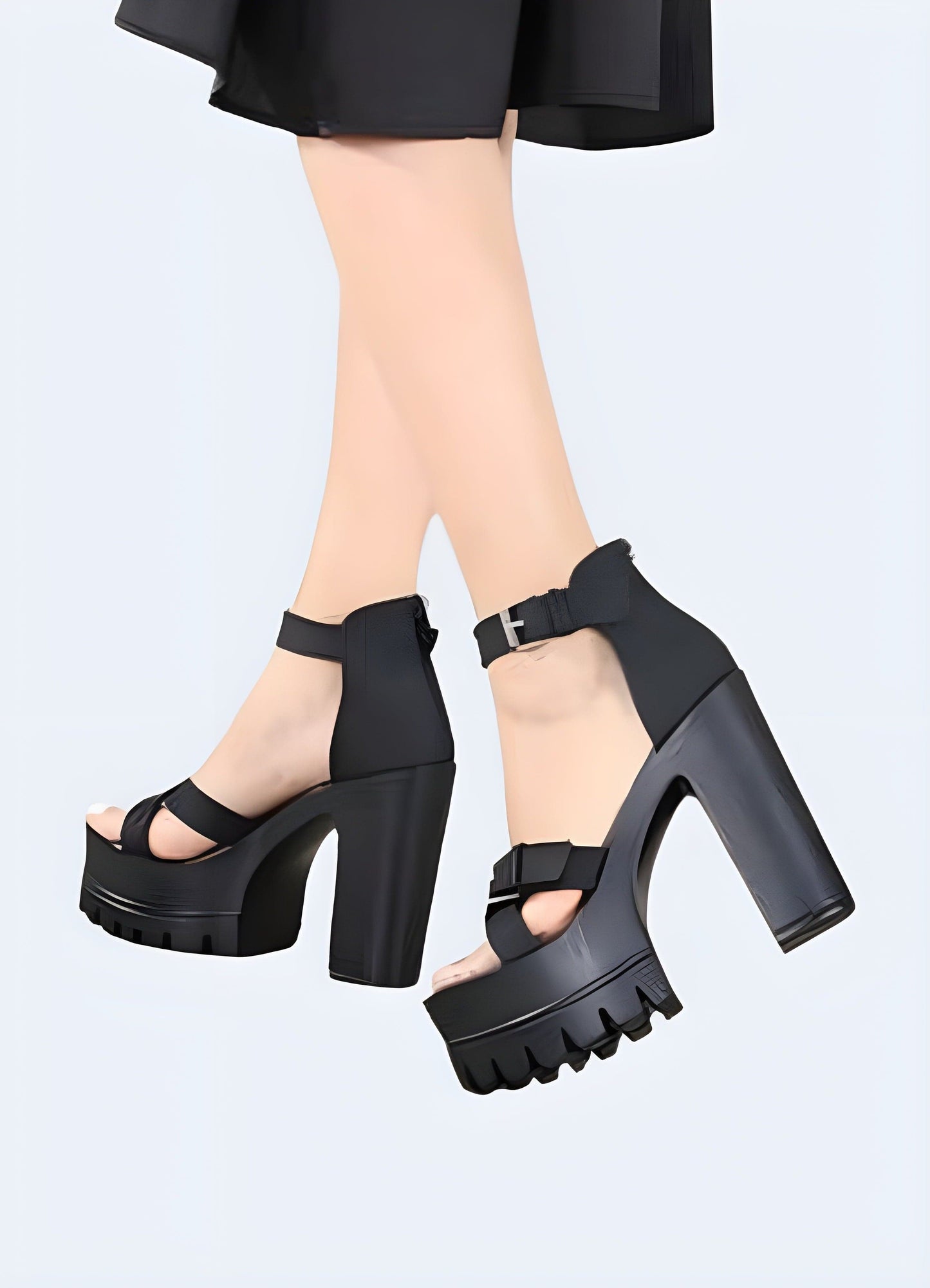 Back and side view of a woman wearing black chunky strap sandals, highlighting the trendy design, secure fit, and fashionable appeal ideal for confident individuals.