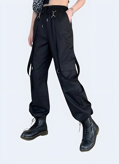 Front side view of a woman wearing cargo pants with straps, showcasing the trendy and practical design popular among UK fashion enthusiasts.