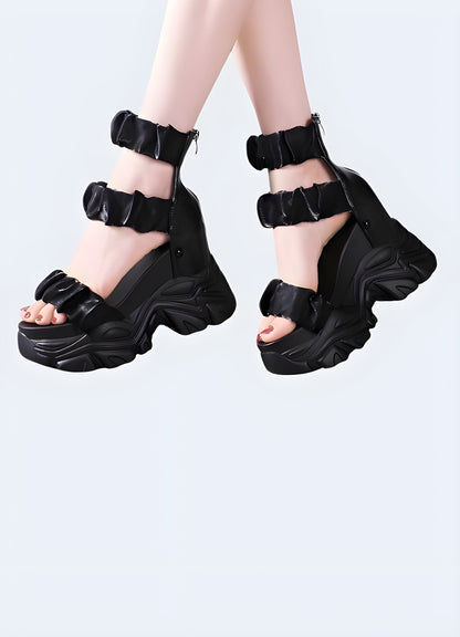 Side view of a woman wearing a chunky black sandal, showcasing the trendy silhouette, robust construction, and fashionable appeal ideal for confident individuals.