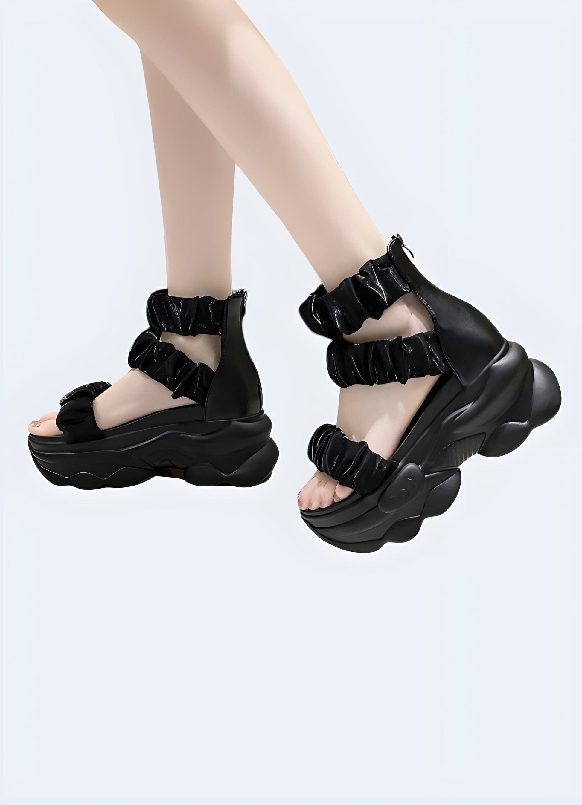 Front and side view of a woman modeling a chunky black sandal, highlighting the eye-catching design, comfortable fit, and versatile aesthetics suitable for various occasions.