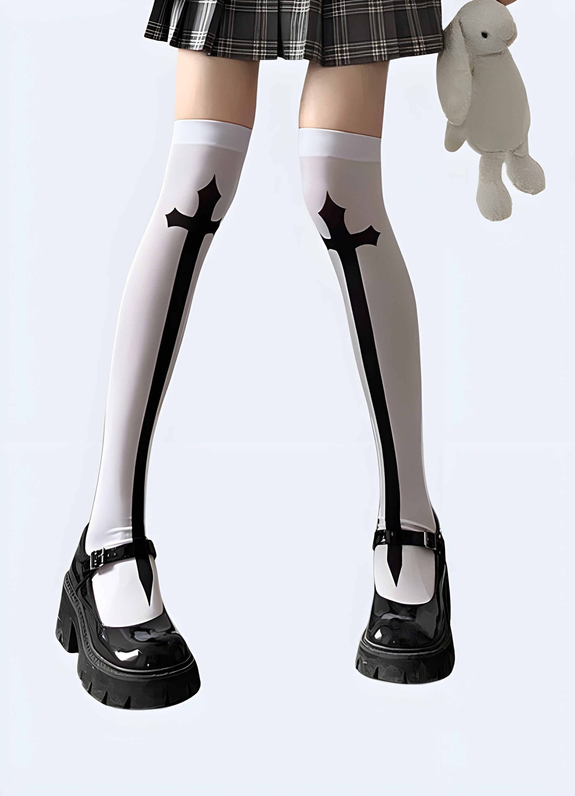 Female model showcasing the front view of cross knee-high socks, highlighting the stylish design and perfect fit that appeals to fashion-forward women in the UK.