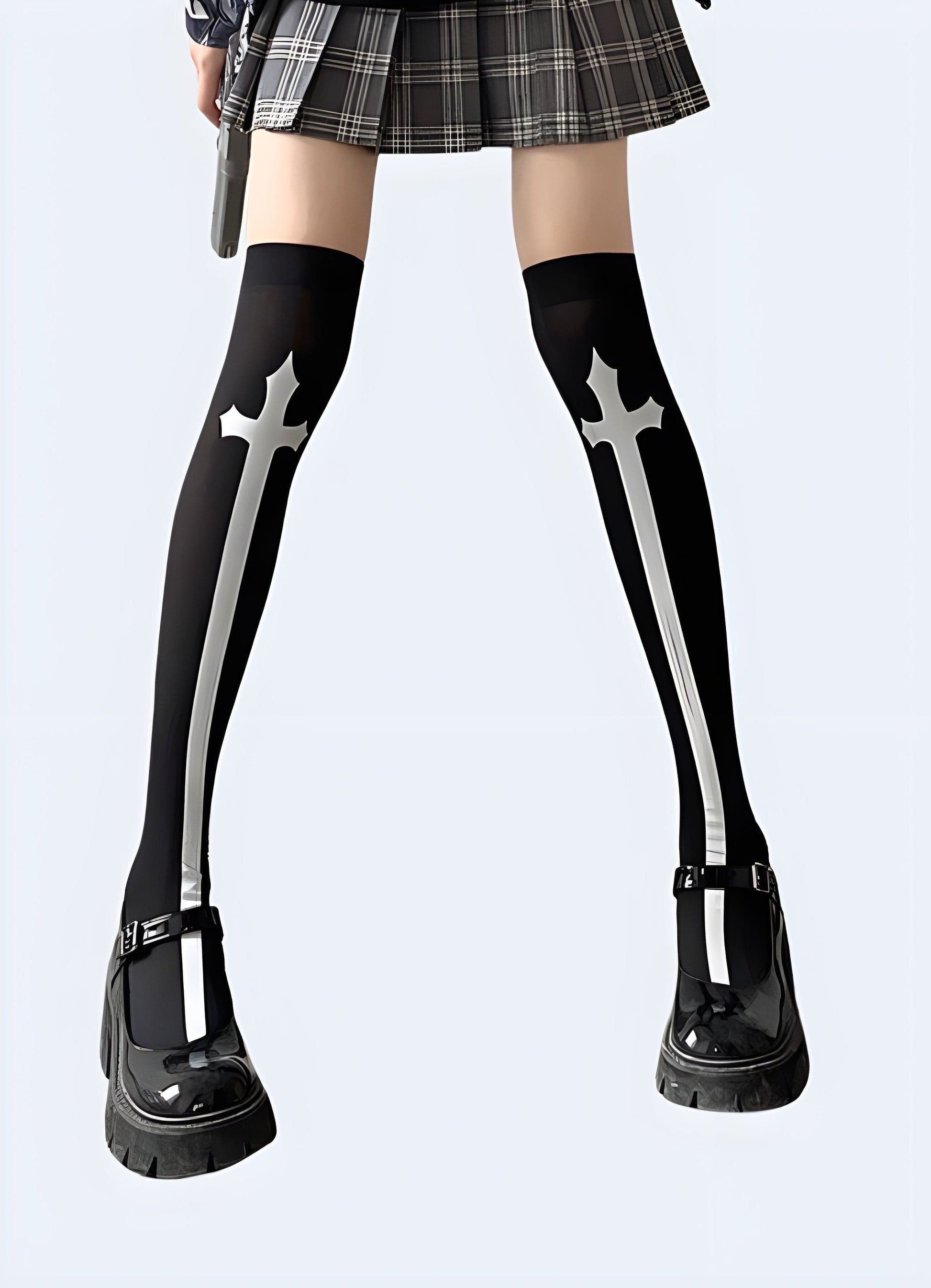 Front view of a woman wearing fashionable cross knee-high socks, showcasing the eye-catching pattern and sleek silhouette popular among UK fashion enthusiasts.