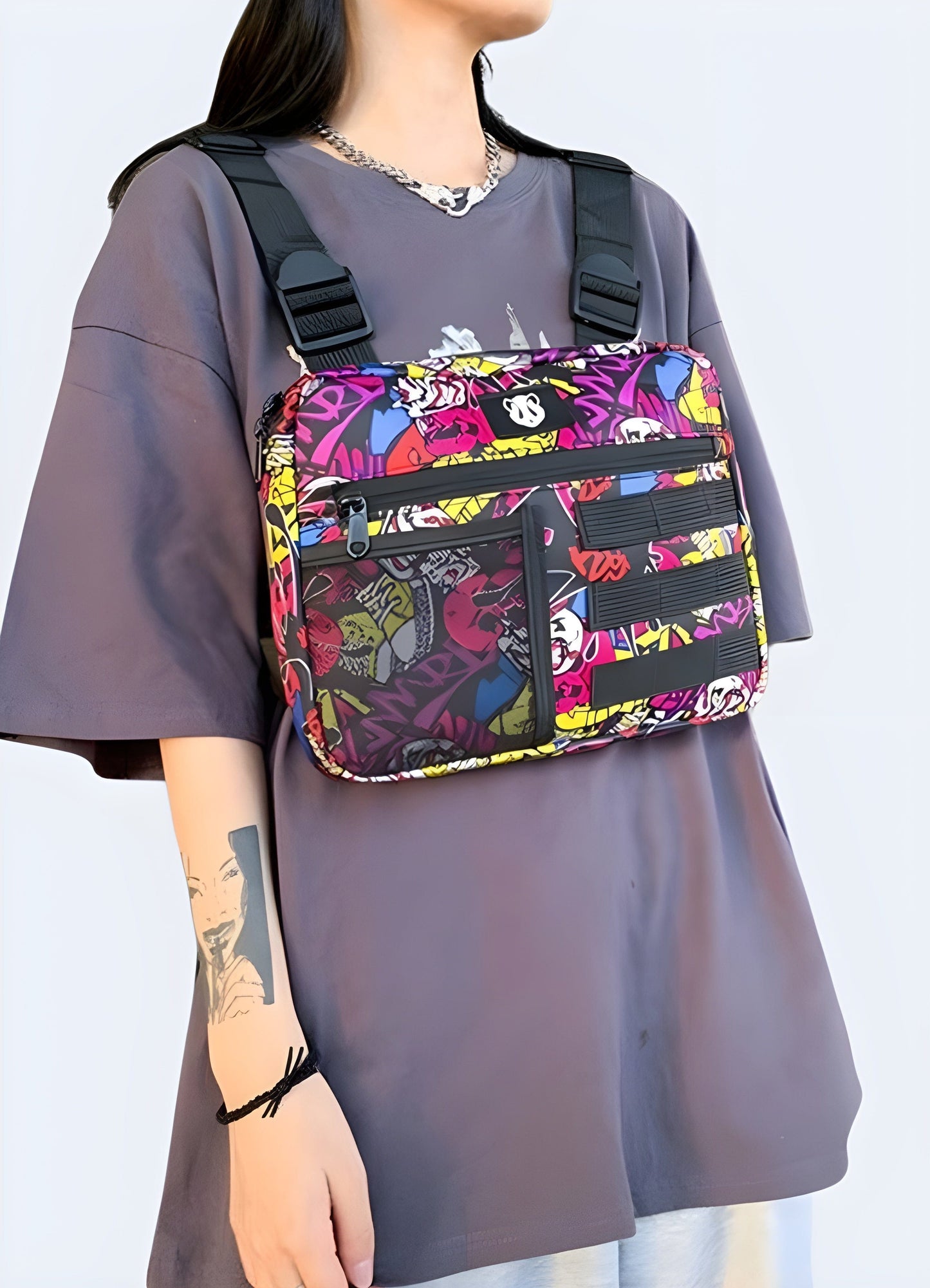 Woman wearing designer chest utility bag, front view, UK. Fashionable and practical choice.