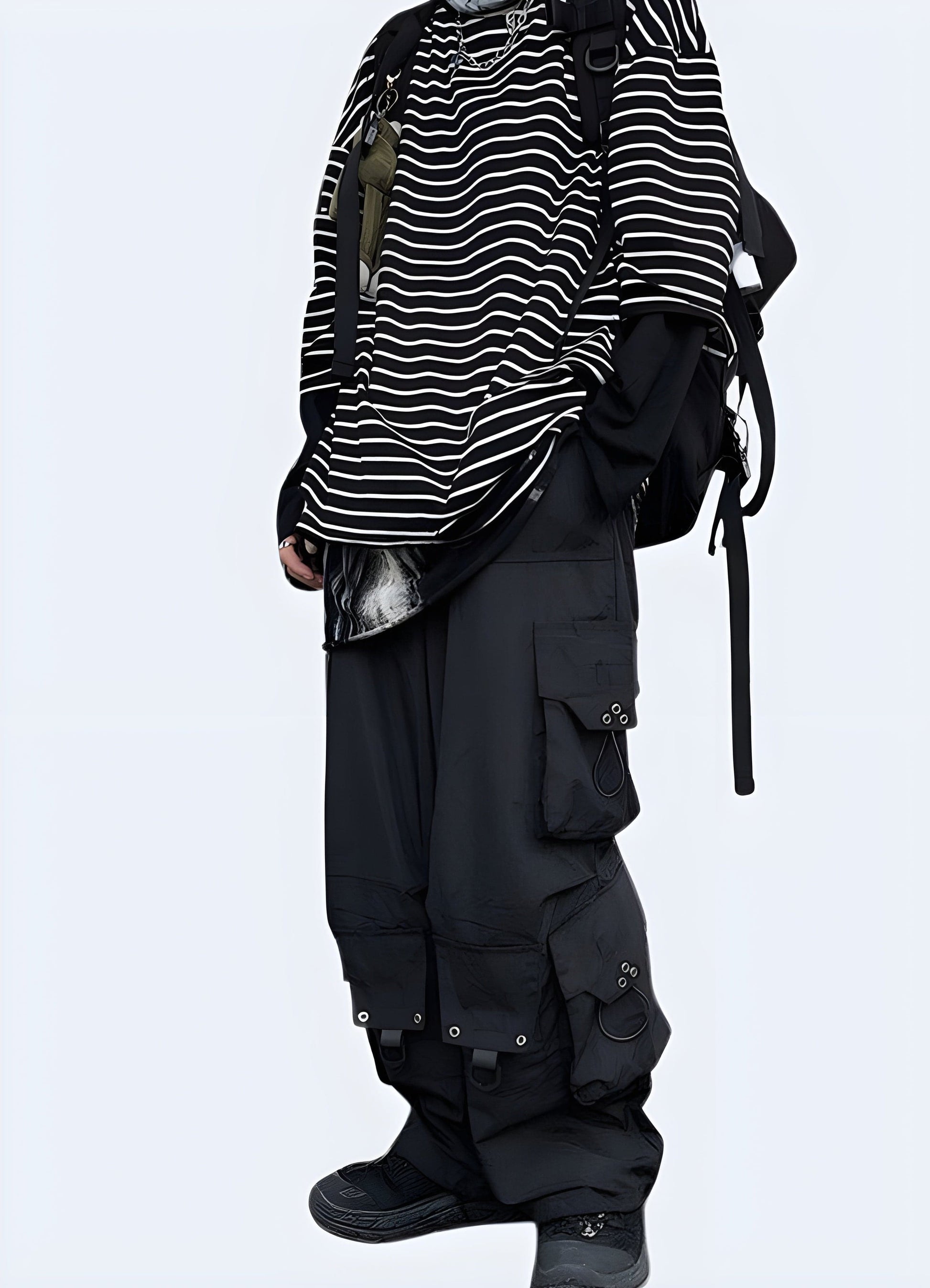 Woman modeling techwear cargo pants, showcasing the sleek design and practical features in a left side view, ideal for UK customers.