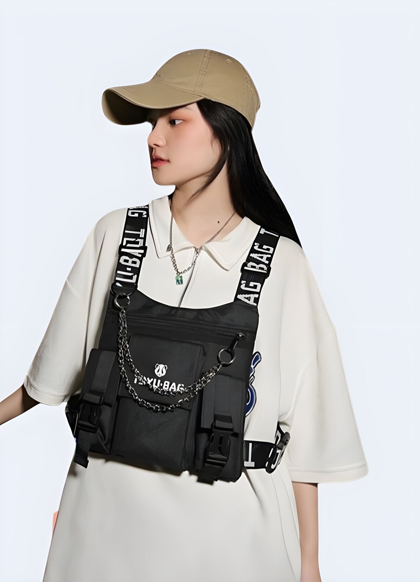 A woman wearing a techwear chest bag in front view, highlighting the functional and stylish design suitable for techwear fashion enthusiasts in the UK.