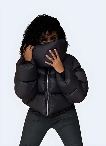 Front view of a woman sporting a techwear down puffer jacket, highlighting its fashionable design and advanced insulation technology for UK women.