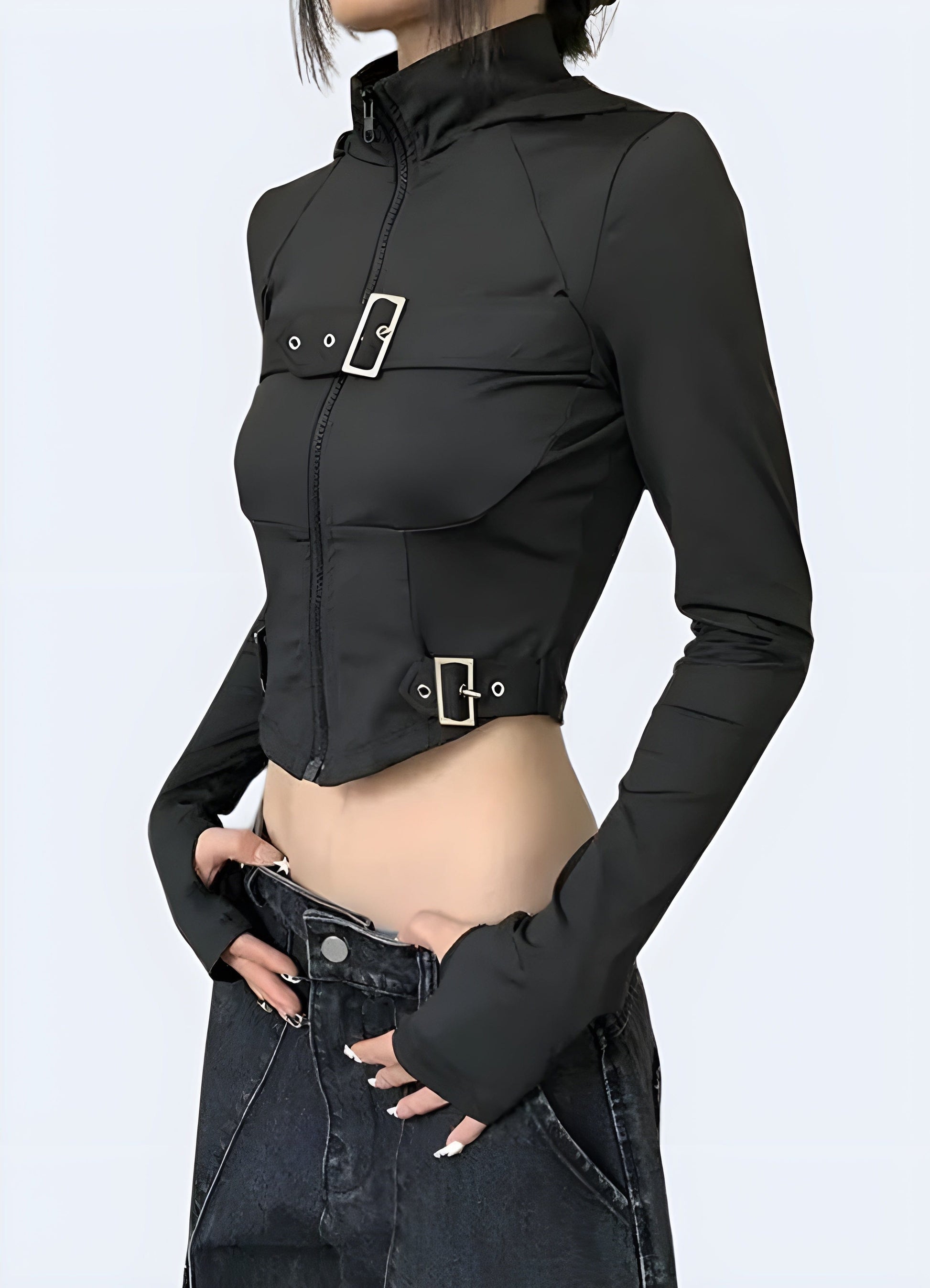 Side view of a woman sporting a techwear goth crop top, highlighting its unique silhouette and attention to detail for those embracing the goth subculture in the UK.