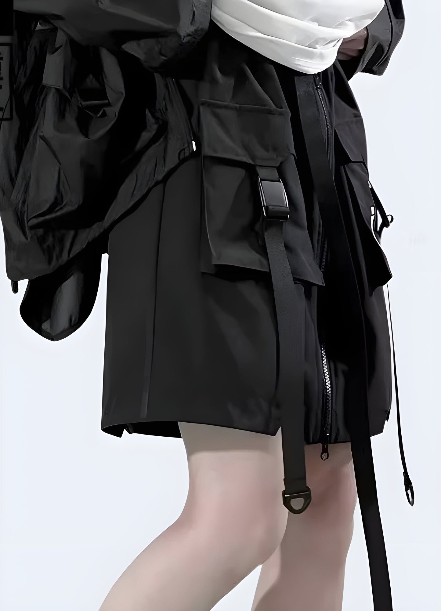 Side view of a woman modeling a modern techwear skirt with functional pockets, designed for comfort and utility during various activities in the UK.