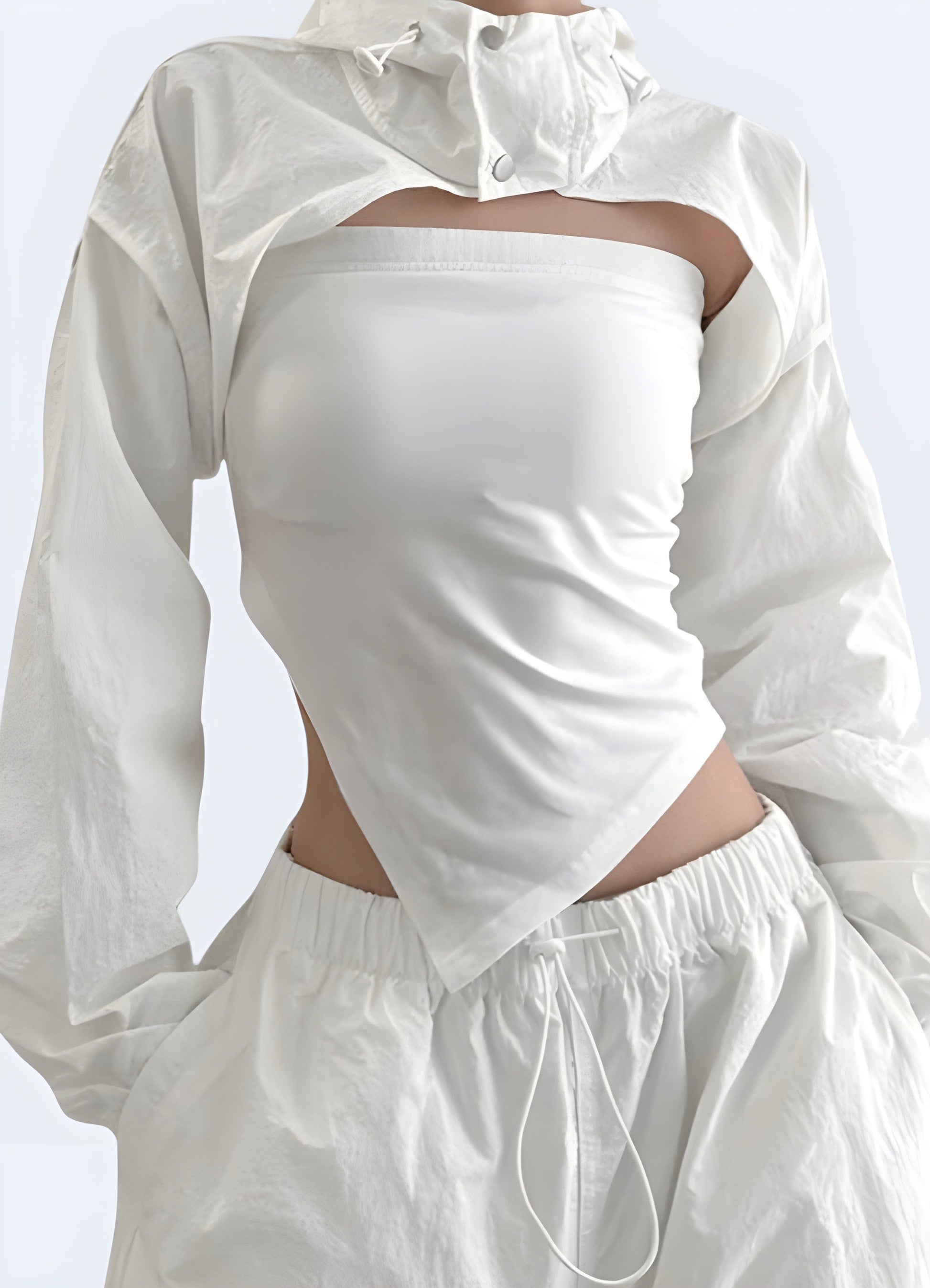 Front view of a woman wearing a white turtleneck crop top, showcasing its elegant design and flattering fit for stylish women in the UK.