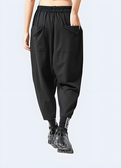 Back side view of a woman wearing women's techwear harem pants, highlighting the fashionable and practical features ideal for everyday wear in the UK.