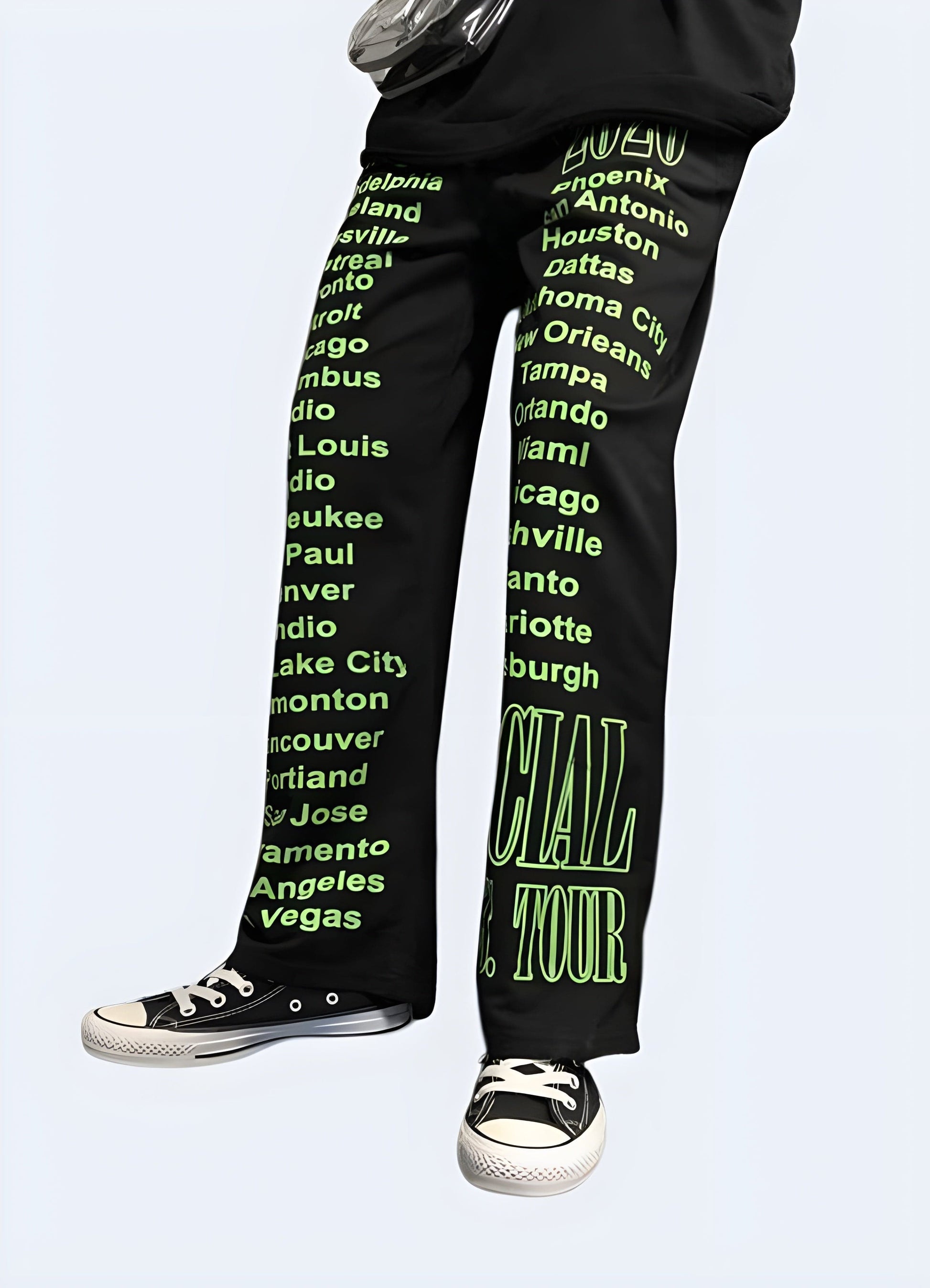 Side view of a woman wearing trendy women's black and green pants, showcasing the unique color combination and sleek design popular among UK fashion enthusiasts.