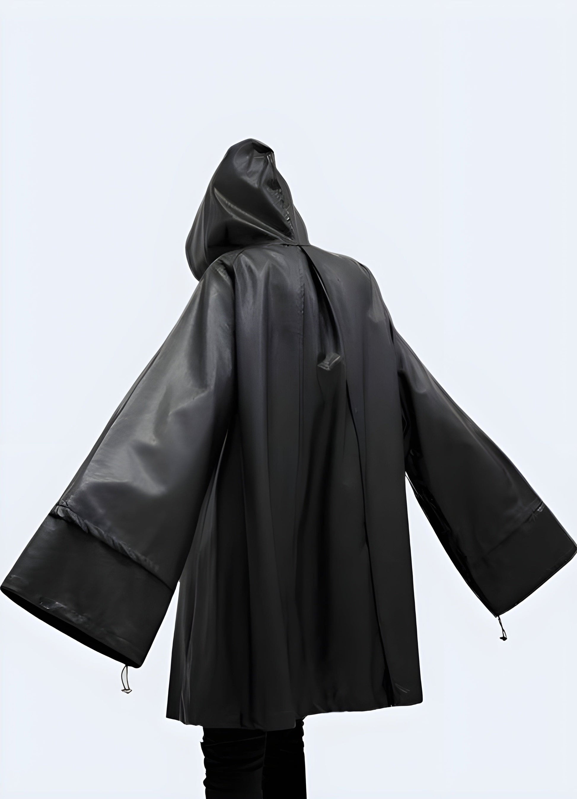 Back view of a woman wearing a women's waterproof rain jacket, showcasing its practical features and stylish design for wet weather in the UK.