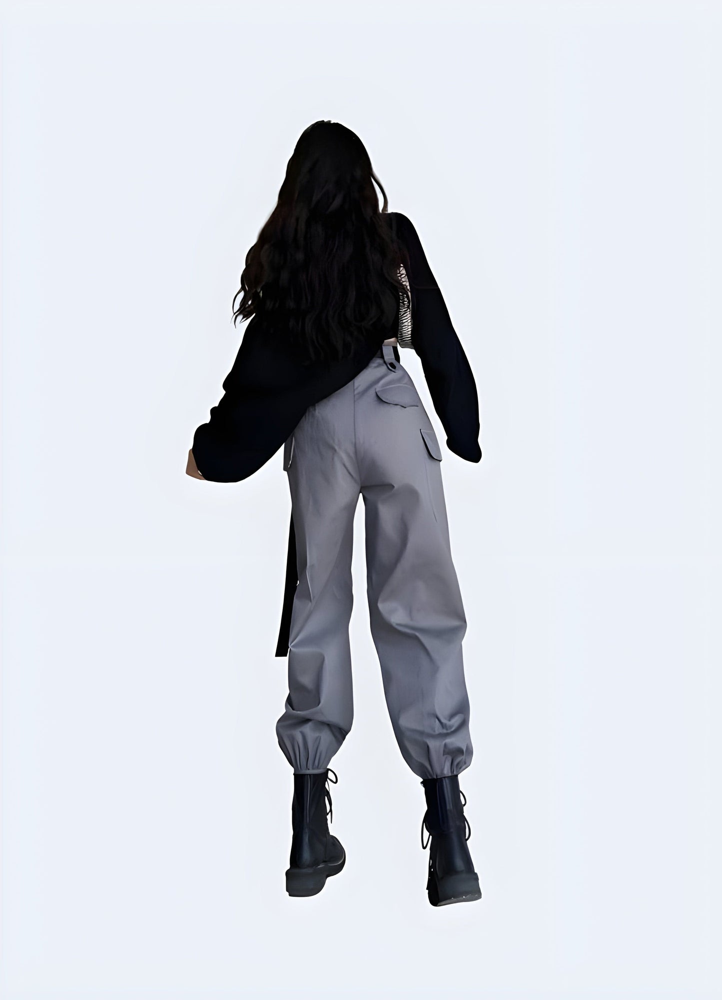 Back view of a woman wearing women's techwear joggers, showcasing the relaxed fit and modern design popular among UK fashion enthusiasts.