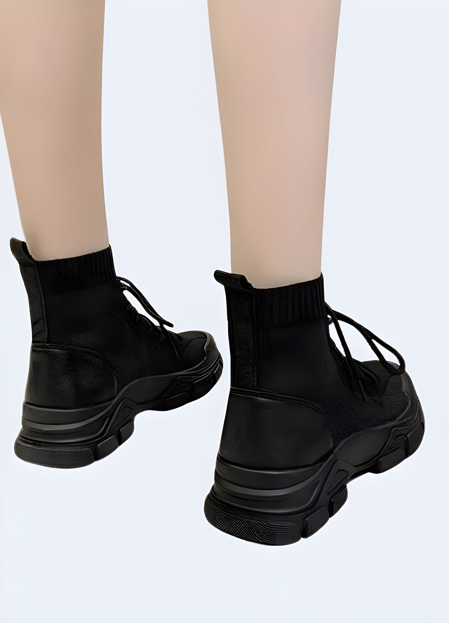 Woman wearing women's high-top ninja shoes, back view, stylish and functional footwear, available in the UK