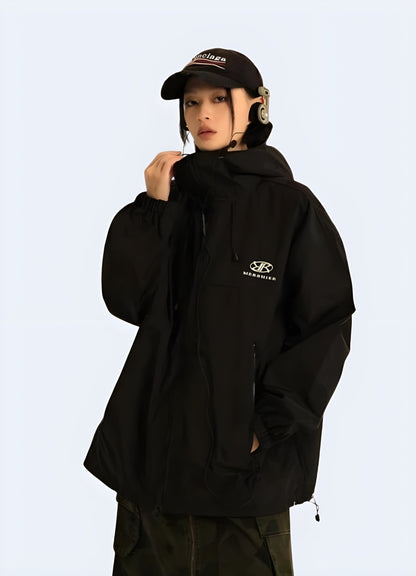 Front side view of a woman wearing a women's windbreaker jacket, showcasing its sleek design and functional features for active lifestyles in the UK.