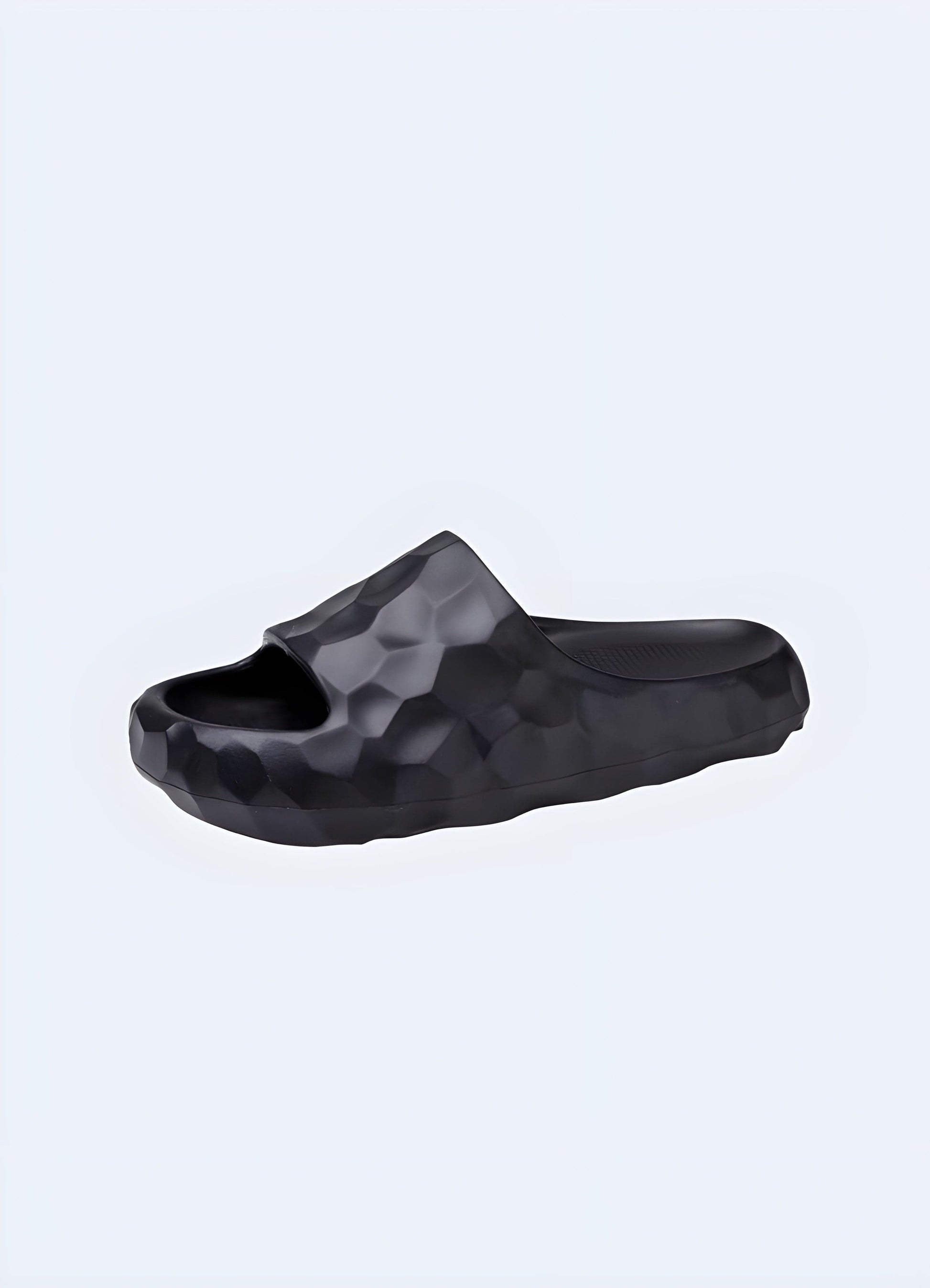 Side view of women's black chunky sandals, showcasing the trendy silhouette, robust construction, and versatile aesthetics suitable for various occasions.