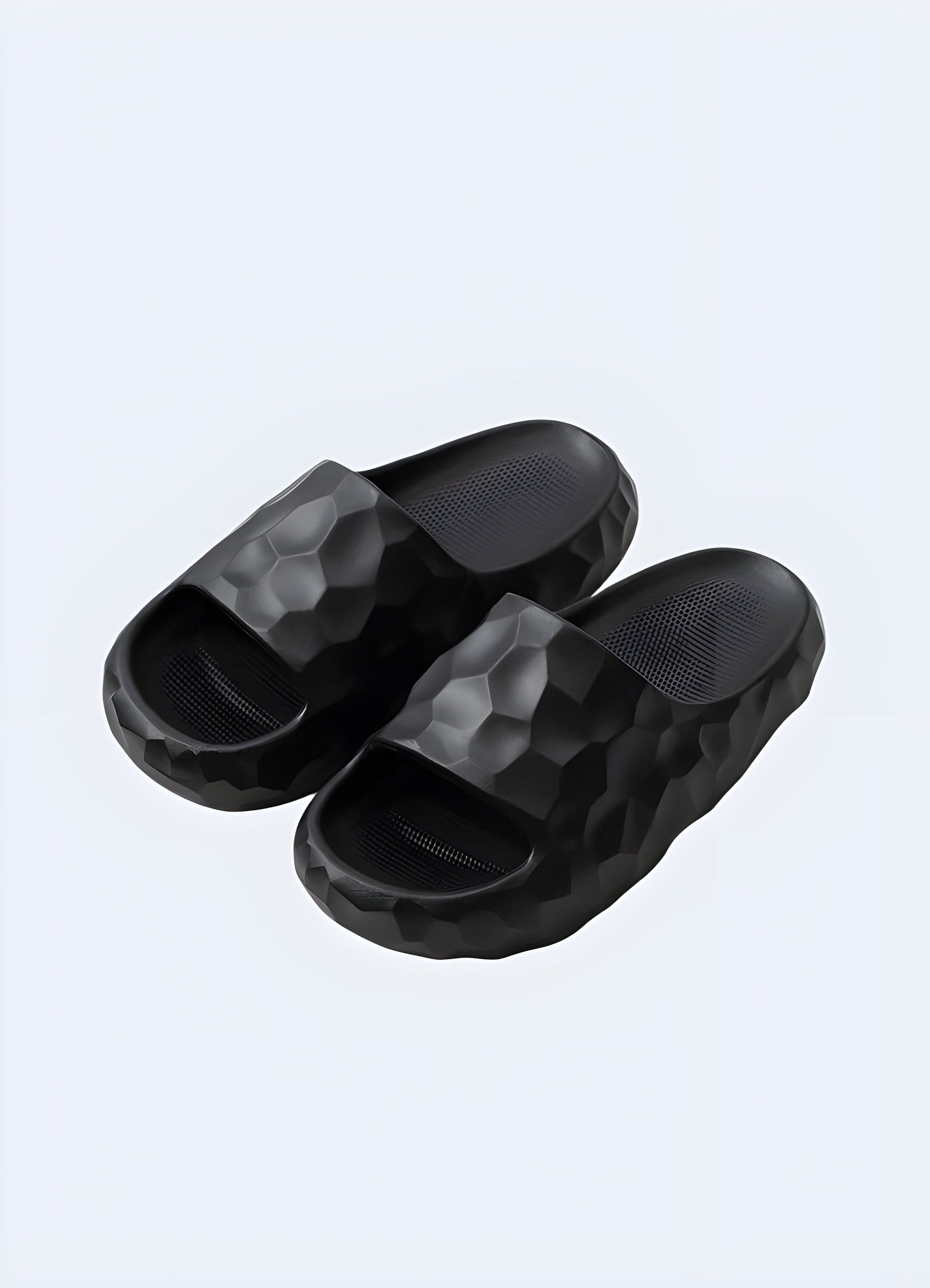 Women's black chunky sandals with a bold and modern design, perfect for adding a stylish and edgy touch to any summer outfit while ensuring comfort and support.