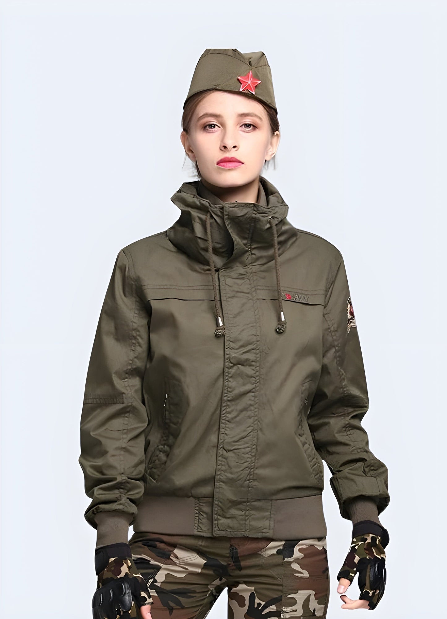 A woman wearing a high-quality, UK-designed tactical jacket, showcasing the front view of the garment's practical features and sleek design.