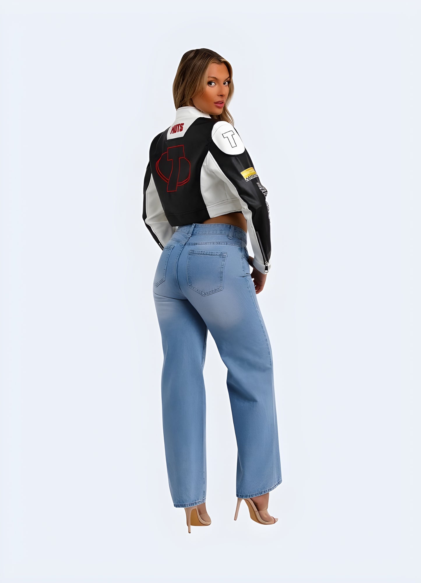 Back side view of a woman sporting a motorcycle pullover crop top, highlighting its high-quality materials and attention-grabbing design for a standout fashion statement in the UK.