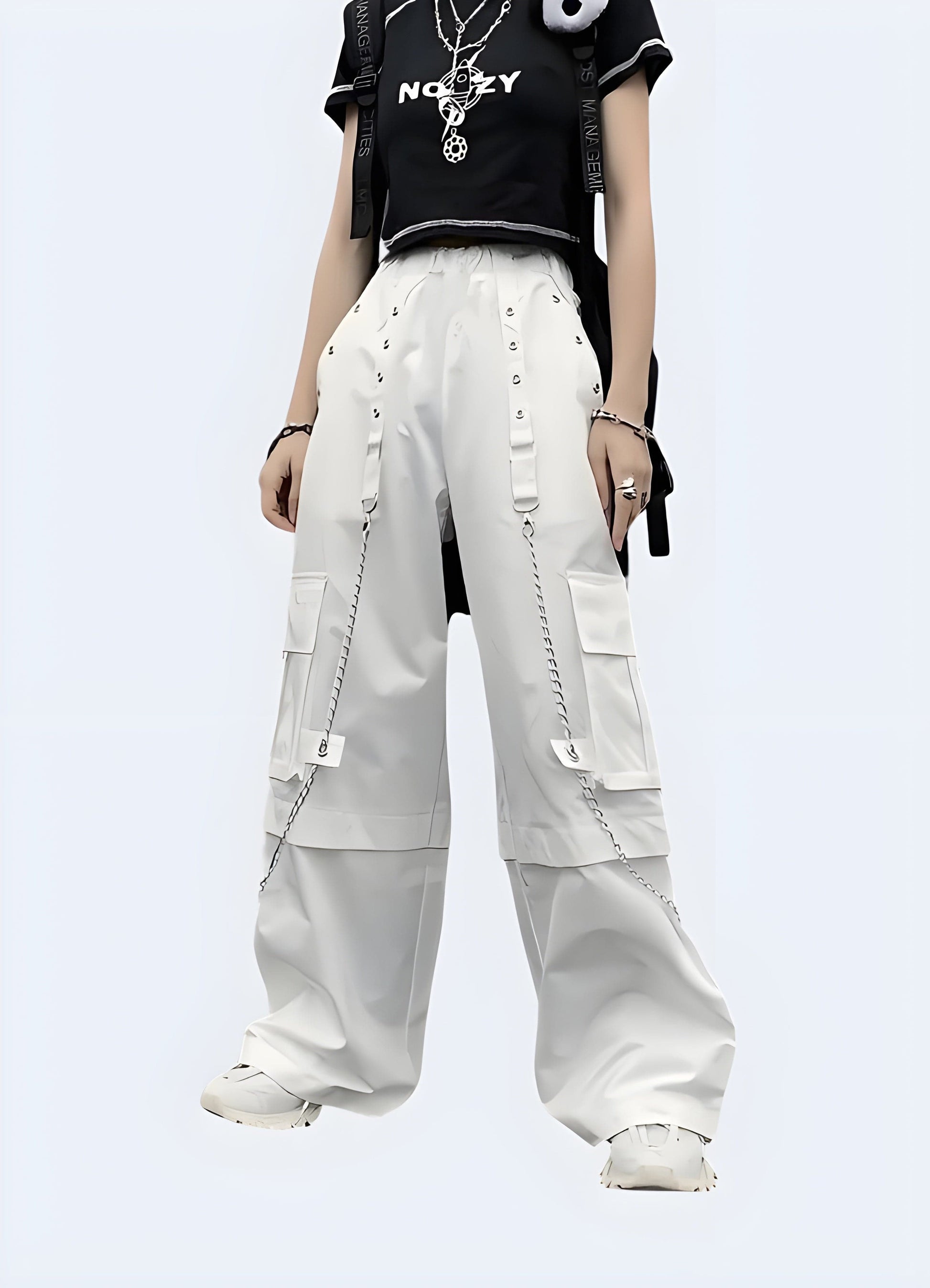 Front view of a woman wearing trendy white cargo pants embellished with silver chains, captured in a contemporary UK environment, highlighting the fusion of functional and rebellious fashion elements.