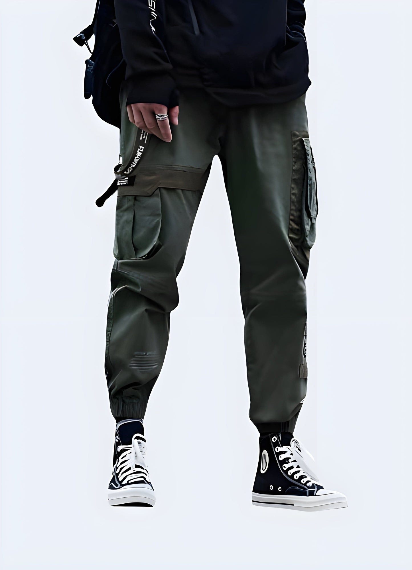 Front view of a man sporting stylish baggy techwear pants, highlighting the spacious fit and innovative materials, a must-have for UK consumers seeking a bold and comfortable look.