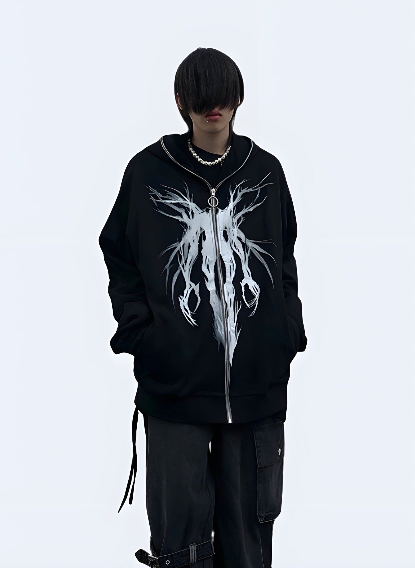 Edgy black grunge hoodie with a distressed look, perfect for alternative fashion in the UK.