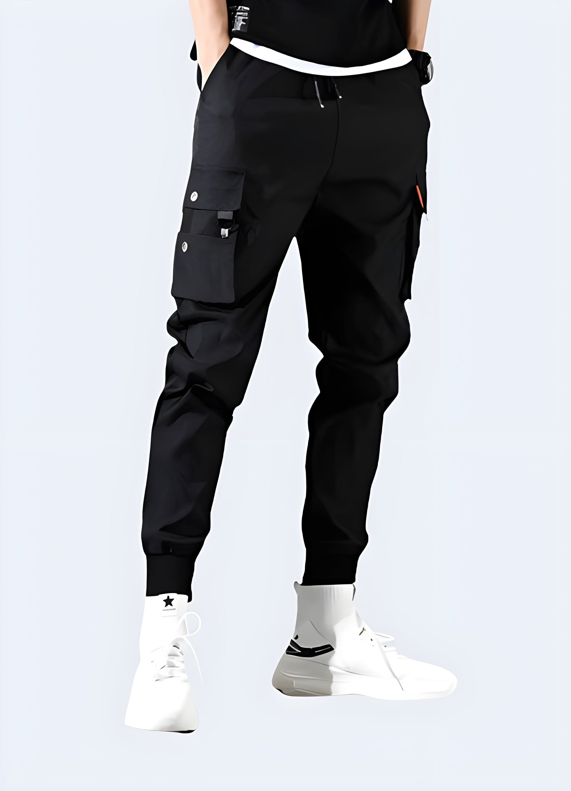 Sleek black slim-fit cargo pants available in the UK, offering a contemporary blend of style and functionality with a streamlined silhouette and practical pockets.