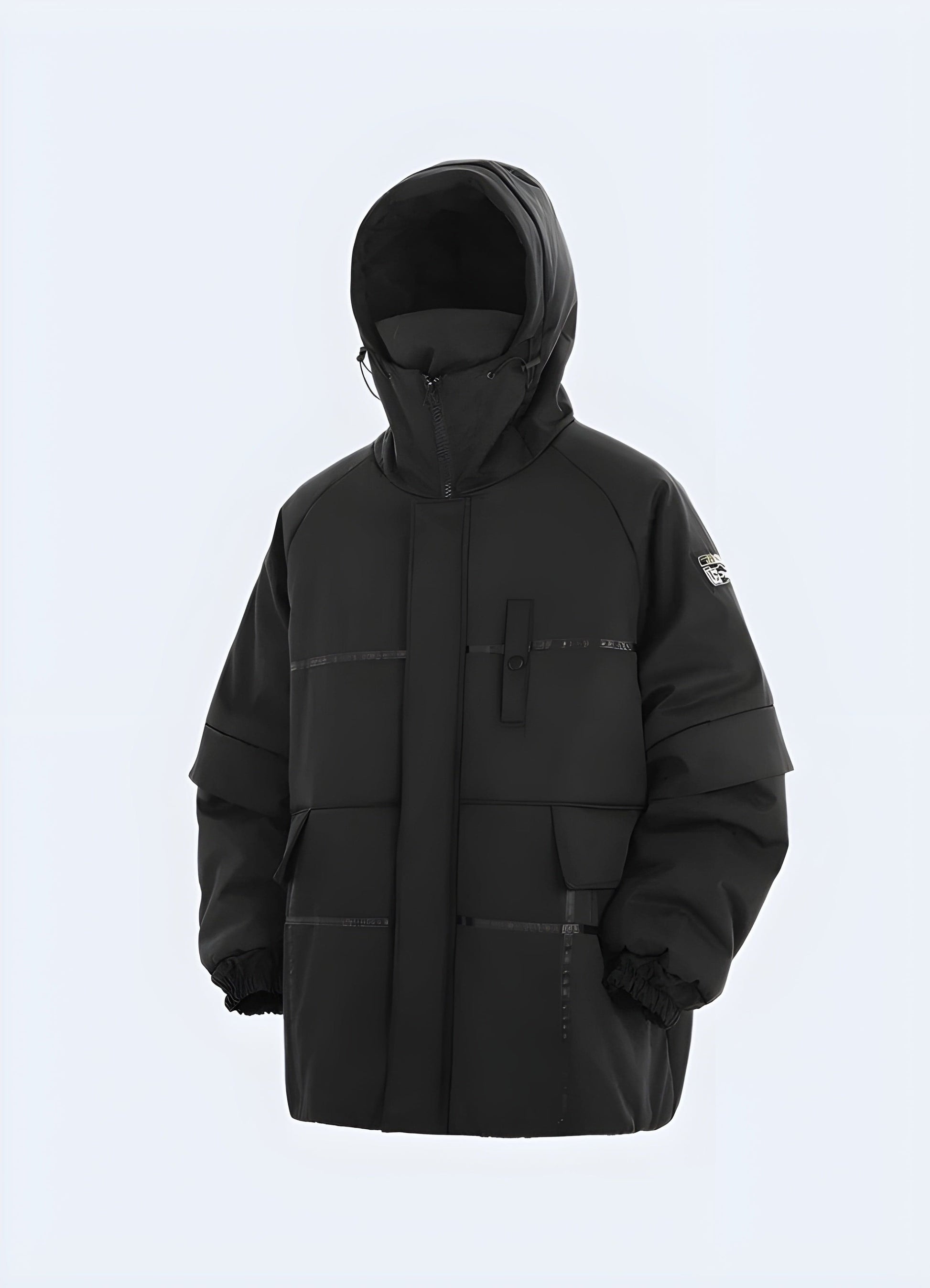 Front view of a model showcasing a black techwear jacket, emphasizing its streamlined silhouette and high-tech materials, ideal for style-conscious UK consumers seeking a functional and fashionable outerwear solution.