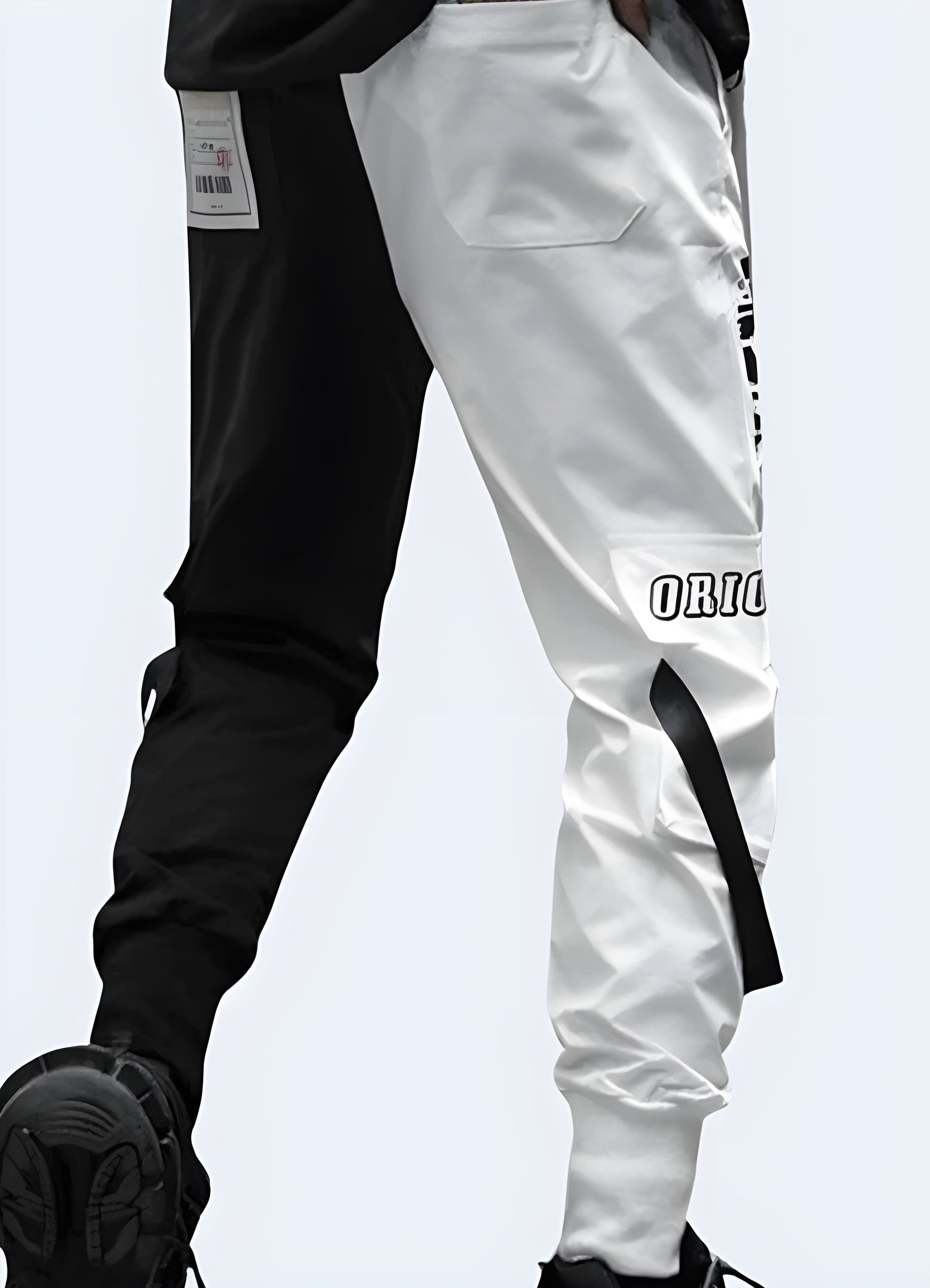 Man wearing black and white cargo pants in the UK, showcasing the striking contrast and unique design elements from the back view, ideal for fashion-forward individuals.